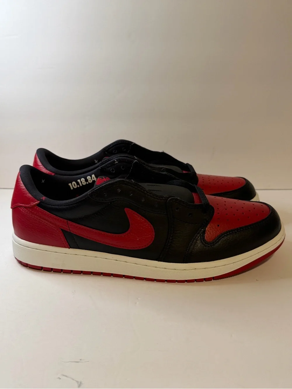Jordan Low Top Sneaker in Black and Red